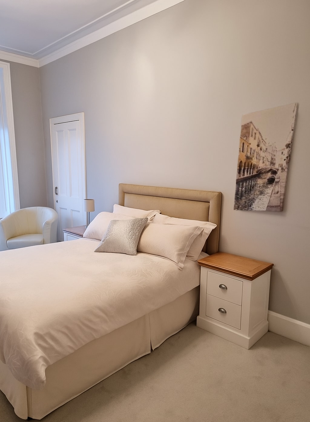 Drift into peaceful slumber in this elegantly appointed bedroom, designed for ultimate comfort and relaxation. Featuring a plush king size bed with crisp linens, you should wake feeling refreshed and ready for your day of adventures. 