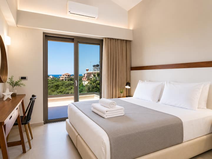Upper Floor - Bedroom 2: Queen-size bed, ensuite bathroom, Smart TV & private sea-view balcony