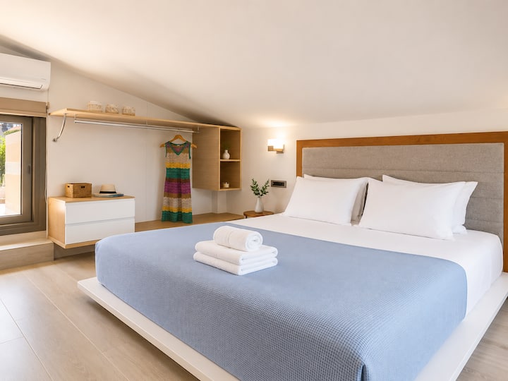 Attic Level - Bedroom 3: Queen-size bed, ensuite bathroom, Smart TV & private terrace with panoramic sea views
