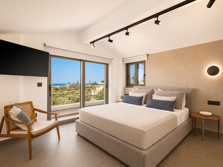 Attic Level - Bedroom 3: Queen-size bed, ensuite bathroom, Smart TV & private terrace with beautiful sea views