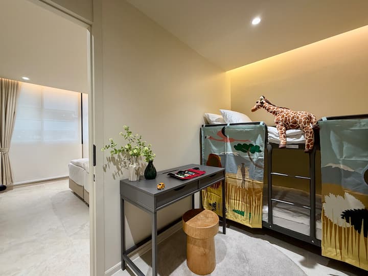 Bedroom 3 features a bunk bed with two separate single mattresses on each level arrangement for two guests.  Bedrooms 2 & 3 each have private entrance. Inside, there is a connecting door that can be used optionally