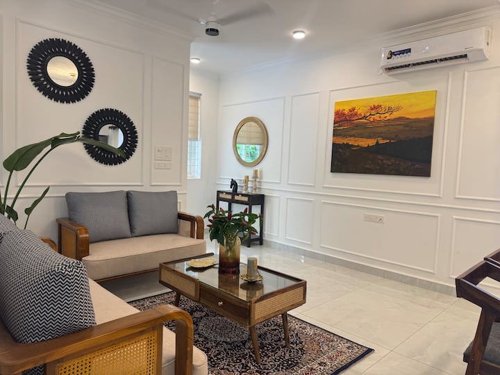 The painting with the dull hues of sunset dominates the space with a quiet presence. Its muted palette-faded ambers and softened grays-captures the fleeting twilight, where day surrenders to night.