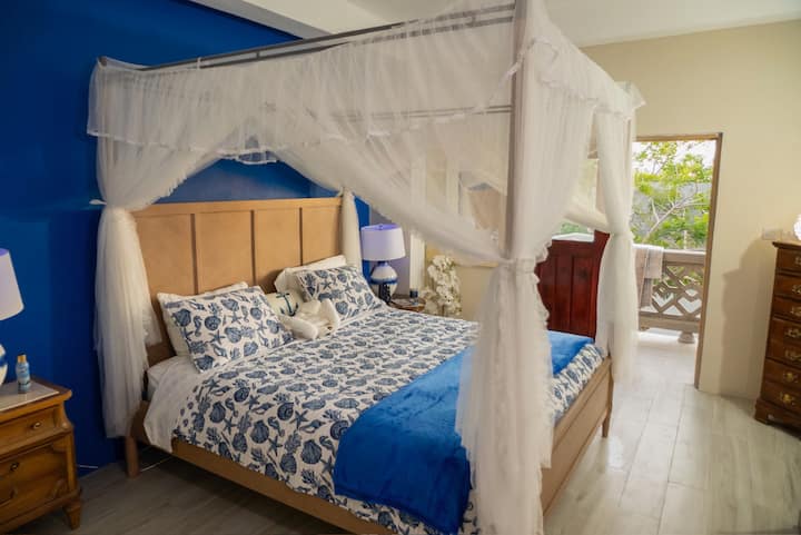 Spacious and comfortable: Bedroom 2 offers a King bed with extra room for an air mattress if you're traveling with a larger group. This room includes a private full bathroom and air conditioning.