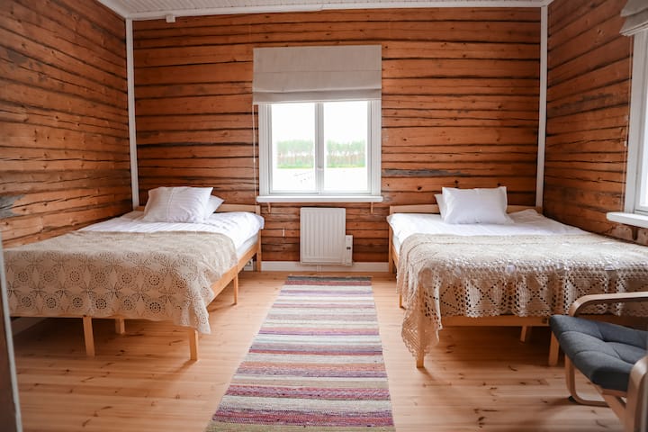 This bedroom has 120 cm and 140 cm wide beds. A travel cot is also available for smaller travelers. Both windows have blackout curtains.