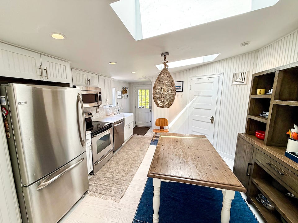 Full kitchen with skylights and dining island