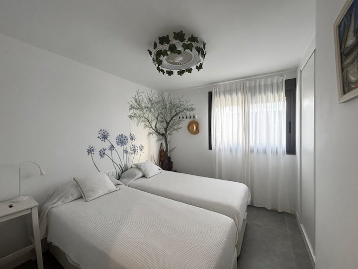 Chambre double avec deux lits simples