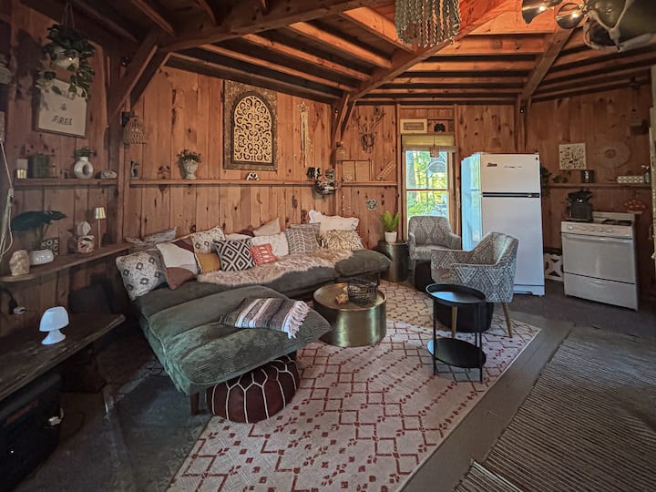 You just stepped in the front door and discovered hippie heaven. Yup, life is amazing. Full size fridge and freezer, propane stove and oven, fully equipped kitchen with pretty much everything you need. Off grid living at its finest.  