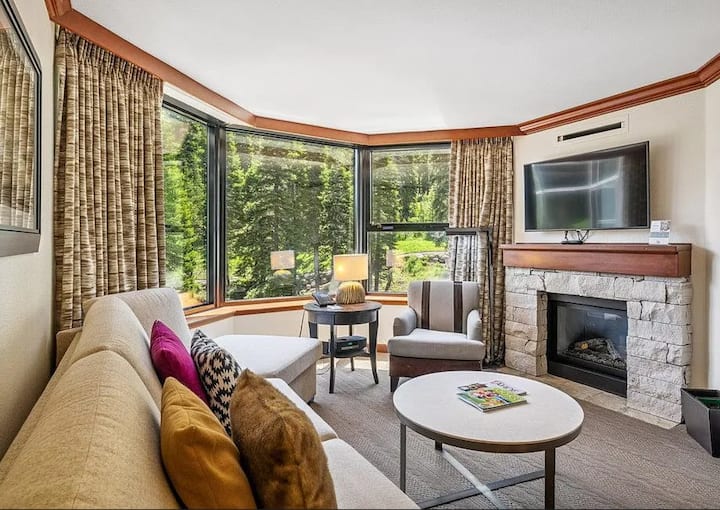 Two bedroom suite with fireplace, mountain views and plenty of seating. Extra sofa bed for extra sleepers as well.