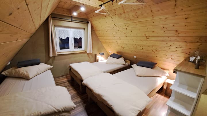 Bedroom "Nº1" with 3 single beds that can be pushed together and sockets at each bed.