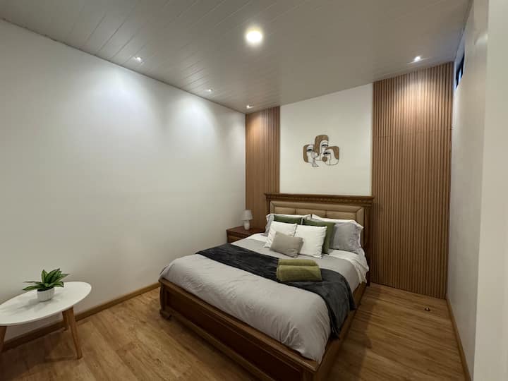 Large comfortable room with a 2.5 person bed, TV and closet 