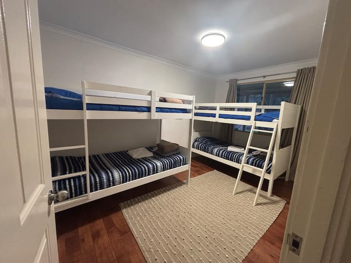 Two bunk beds, ideal of kids or young adults. Top bunk is safest for those 60kg or under.
Please don't jump from the bunks or from one to the other.