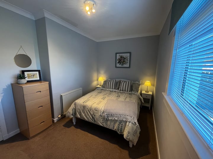 Bedroom 2 with Comfortable Pocket Sprung Double Bed and Ample Storage. Views to the garden and front of the property.