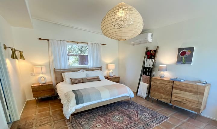 Primary bedroom with en suite bathroom> claw foot tub