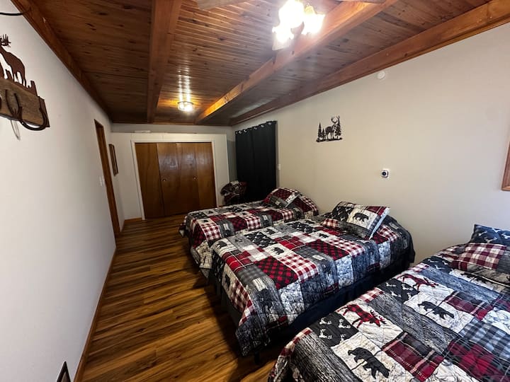 Our lodge has 1 bedroom with 3 XL Twin beds. There is also a fold-out mattress in the closet for a 4th guest/child. In the closet we also have hangers, a fan, and extra chairs for our guest. 