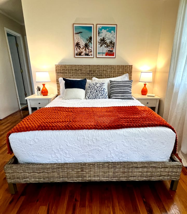 Perched upstairs with the best view in the house, this bright and breezy room offers a front-row seat to the pond.  Shared space with the upstairs living area and isn’t fully enclosed, it’s a guest favorite for sunrise wakeups and laid-back lounging.