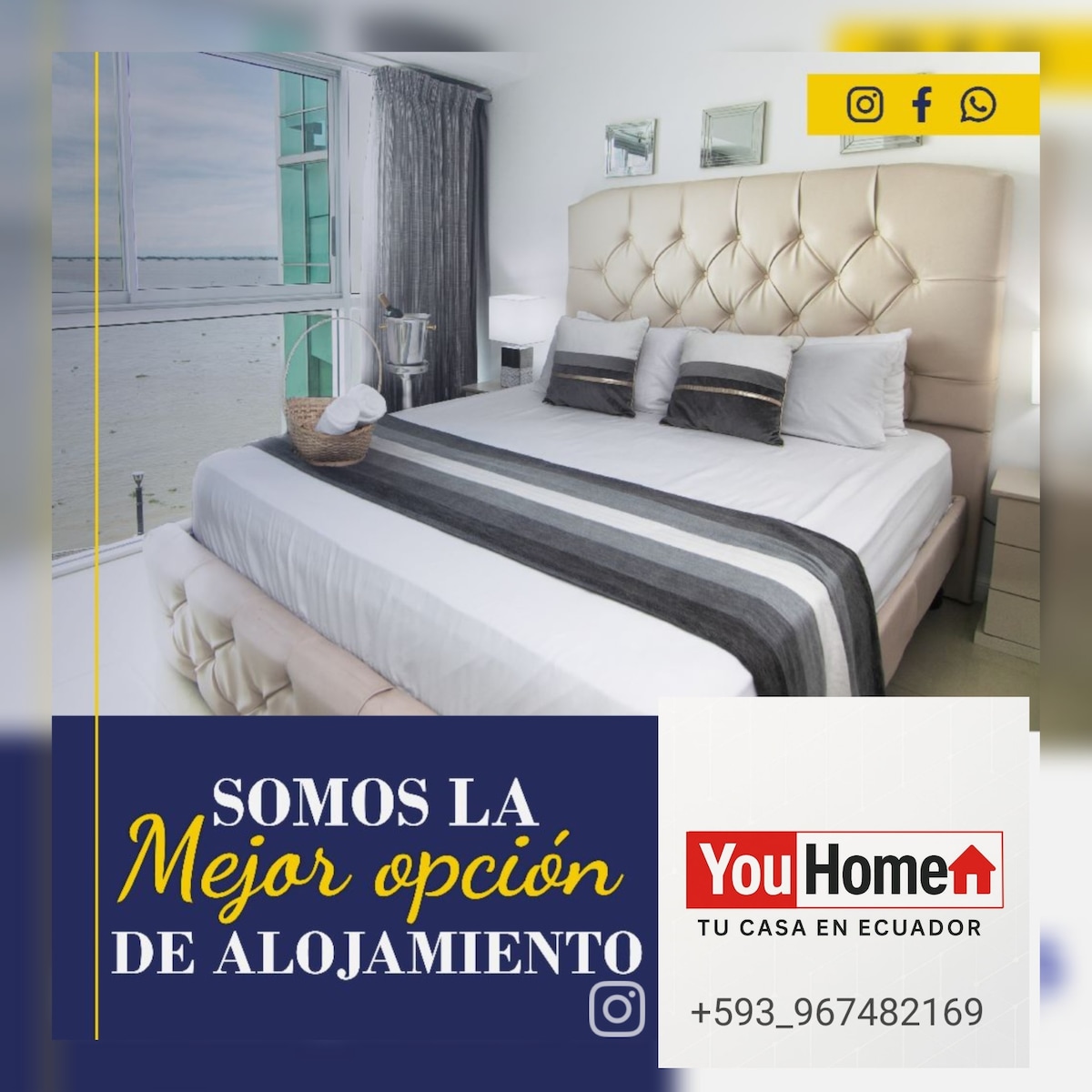 A spacious bedroom features a large bed dressed in neutral-toned linens, complemented by sleek modern furnishings. Large windows allow natural light to flood the room, offering views of the surrounding landscape. A serene ambiance is created by the tasteful decoration and minimal clutter.