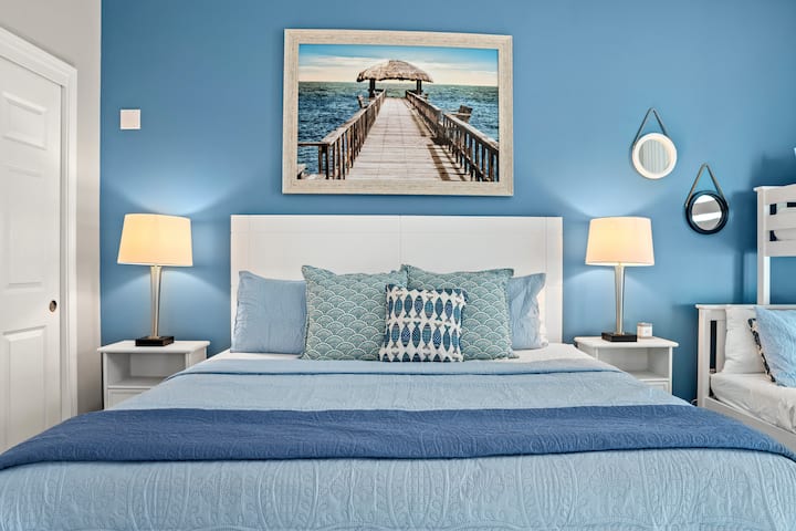 This luxury guest suite offers a king-size bed, a twin-over-double bunk for the kids, a dedicated game space, ample storage, and a Smart TV for relaxing movie nights.