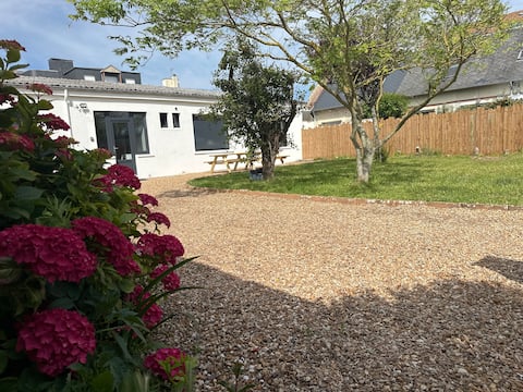 Waterfront house with garden and parking.