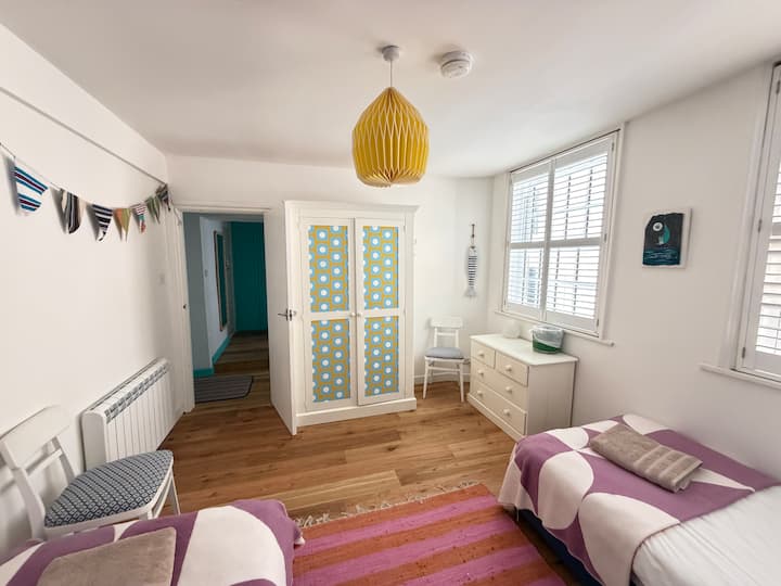 Bedroom 2 with wardrobe and 2 single beds