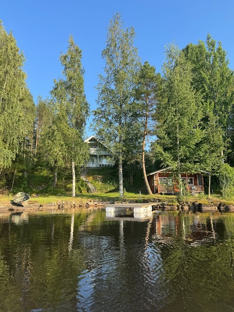 Spacious log house with private beach and sauna