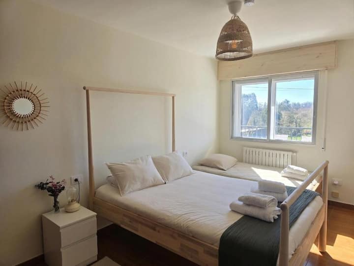 Guaranteed rest in a bedroom equipped with one double bed and one single bed, both with very comfortable mattresses and soft bedding. A quiet, spacious, and cozy space, perfect for relaxing and recharging. Outdoor terrace views