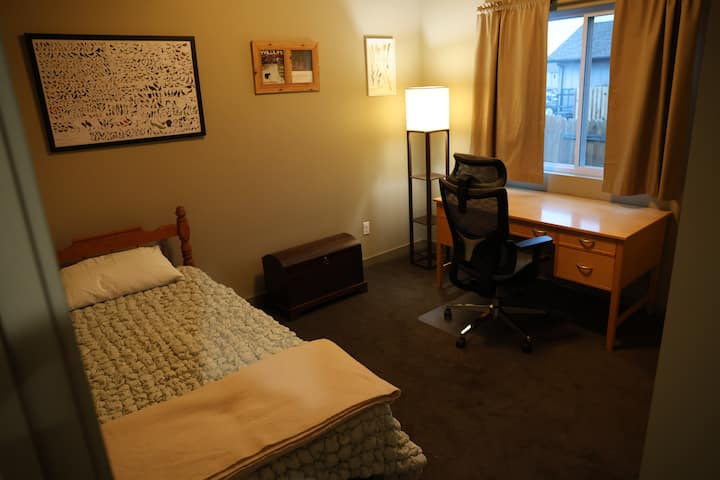 3rd bedroom with twin xl bed, desk and ergonomic chair and full closet with hangers. 