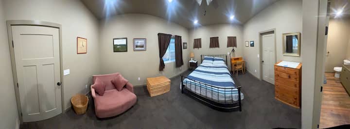 Master bedroom with queen bed, sofa bed, and private full bathroom.