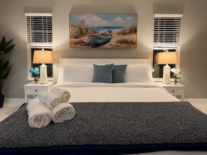 Relax and recharge in a cozy king bed with soft, fresh linens—perfect for unwinding after a day of sun and adventure!