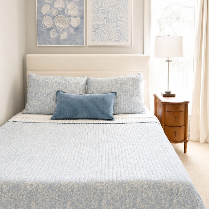 This inviting bedroom features a queen bed, clothes hanger and drawers along with beautiful lake views. It shares a bathroom with Bedroom 3.