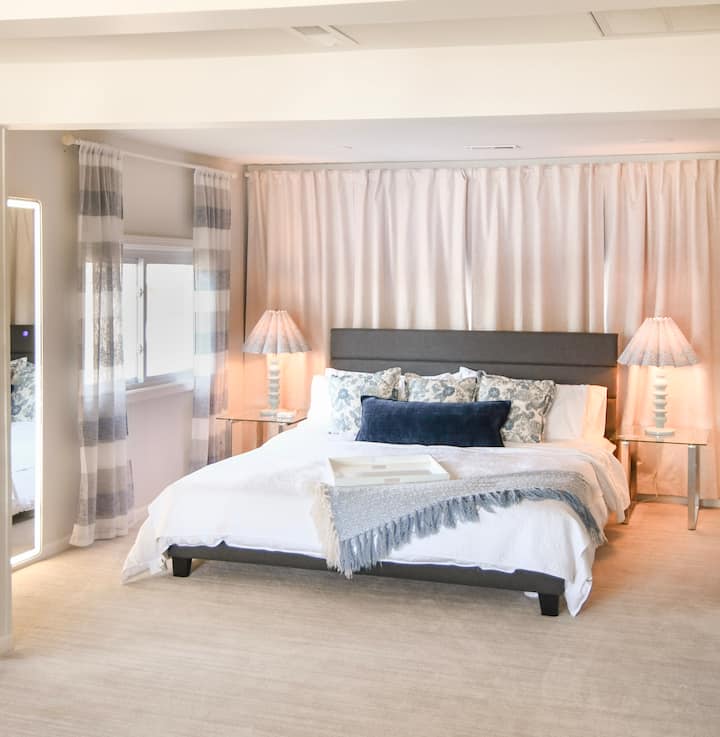 This cozy space includes a sleeper sofa, two recliners, California king bed, closet and built-in vanity. It offers lovely lake views and shares a full bathroom with Bedroom 5.