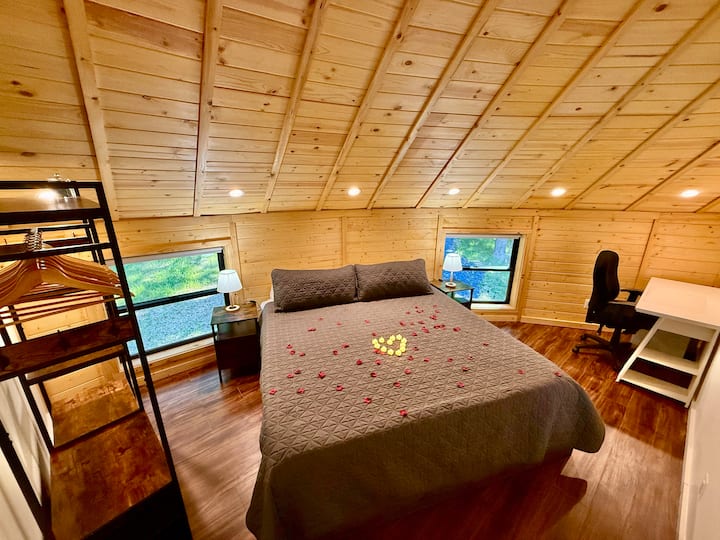Master Bedroom, Loft level: King size bed, night stands with USB and 110v outlets, lamps, wardrobe, hangers, ear plugs, desk, chair outlet/ethernet port. Please contact us for more details on available decoration packages - Front Royal Yurt