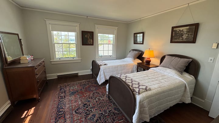 The bedroom with two twin beds has fantastic views over the East River