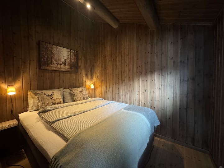 Bedroom 2 - fully made up with duvet, pillow and bed linen. With shelves on each side - ready for a quiet and relaxing night.