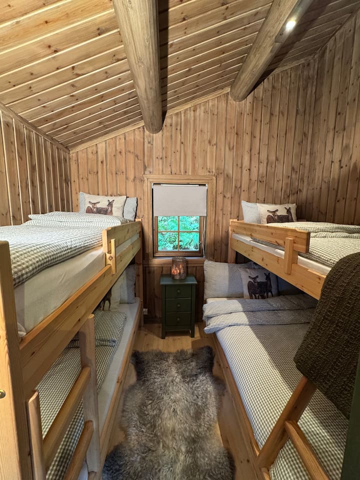 Bedroom 3 - all five beds are made with duvets, pillows and bedding - ready for both adults and children.