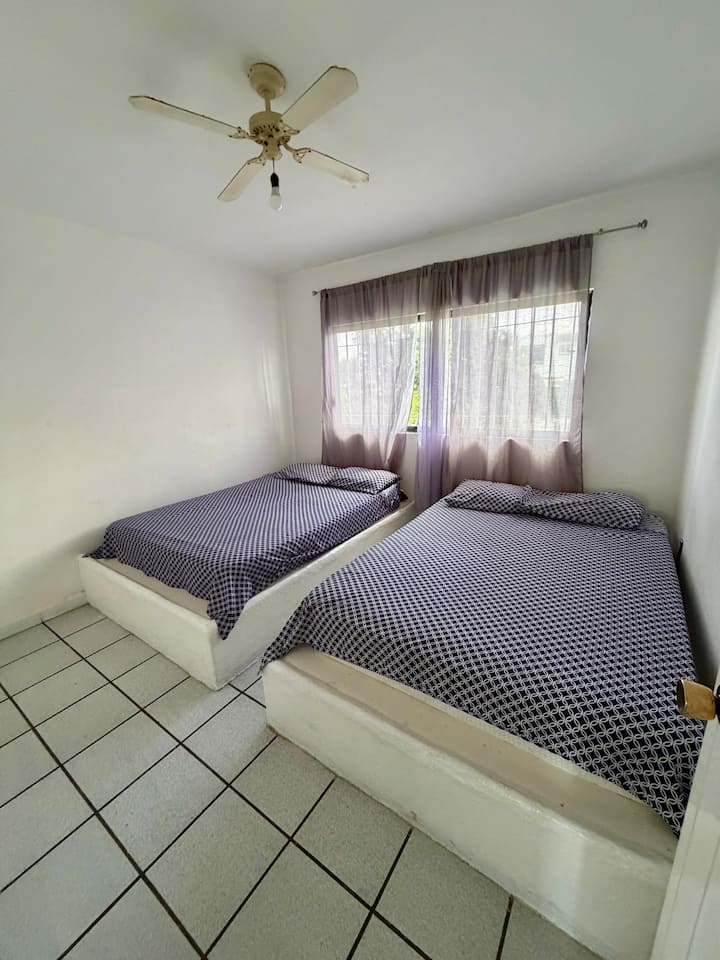 Room #3
With two double beds, a ceiling fan and a large closet.