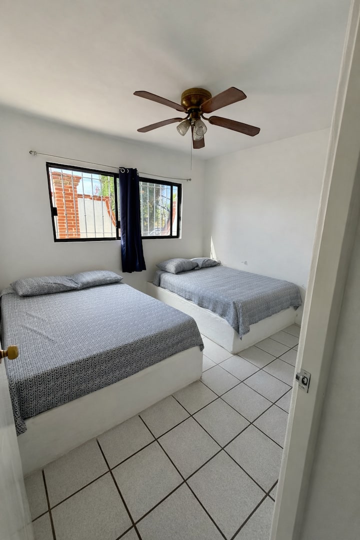Room #1
With two double beds, a ceiling fan, a large closet and a small vanity.