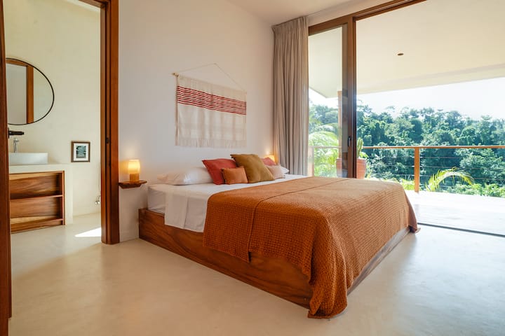 Guesthouse bedroom open to the jungle