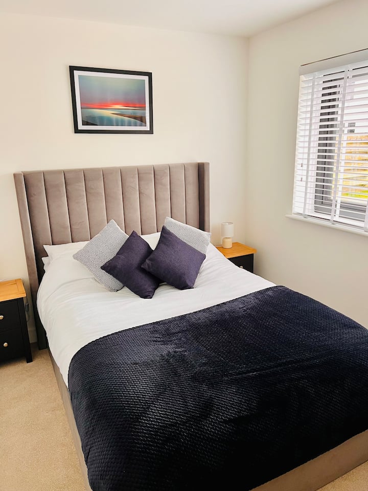 Your third bedroom in the second property  is fresh and bright, overlooking the garden with ample cupboard space for your belongings. You’ll enjoy a comfortable double bed, easy access to the family bathroom, complete with a walk-in shower and bath