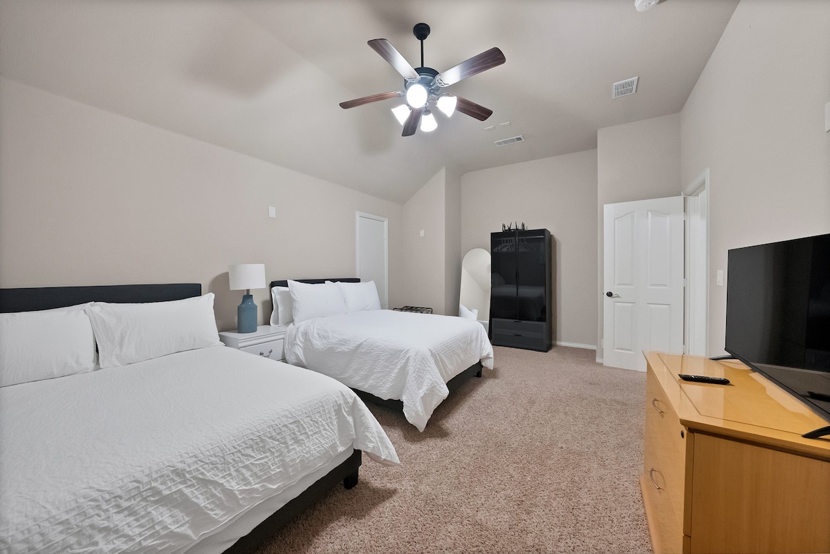 Spacious retreat with two plush beds, full size mirror, luggage racks, lighted closet and smart tv. 