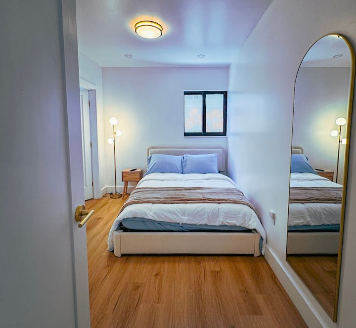 Bedroom 4 with one larger bed and mirror