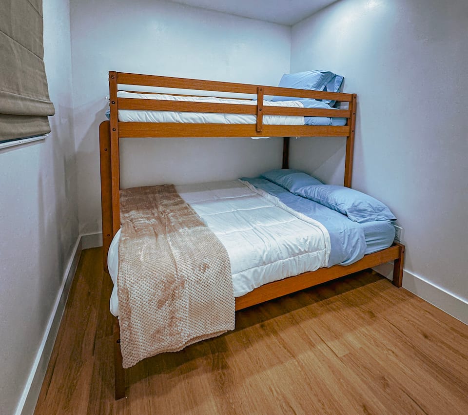 Bedroom 2 with a bunk bed and wider lower mattress