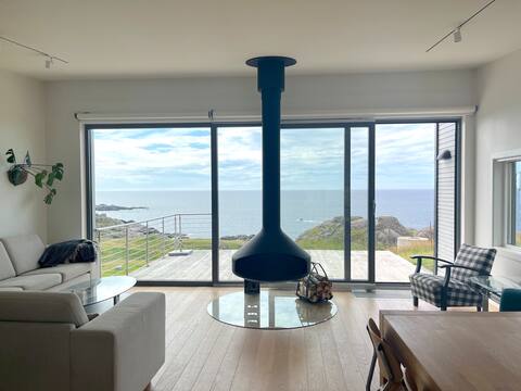 Cabin with open fireplace, ocean view and wood-fired stove