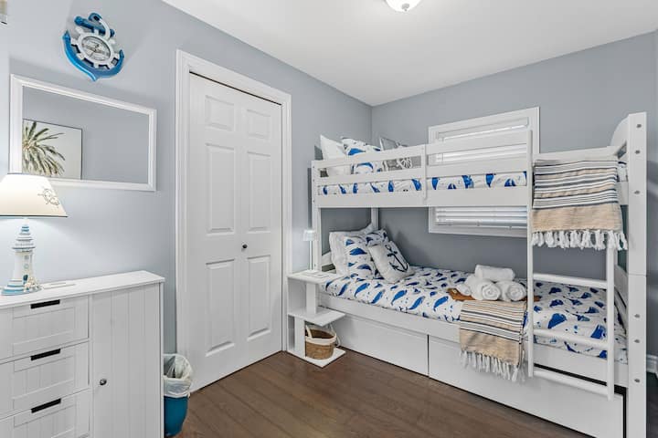 Perfect for families, kids, or friends, this sturdy bunk bed offers two cozy single mattresses with soft bedding for a restful stay. Kids think they're going to sleep in a playground, I know because my kiddos love the top bunk! Enjoy cottage living!