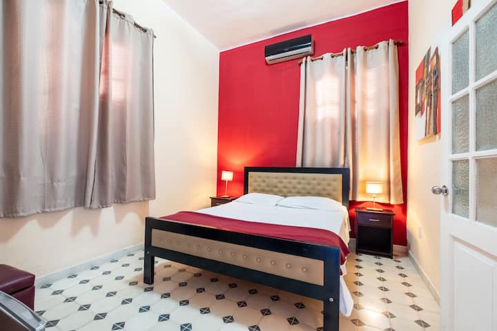 Room # 1. With a queen size bed, AC, TV, safe, mini bar and private en-suite bathroom.

Room 1. With a queen size bed, air conditioning, TV, safe, minibar and private bathroom.