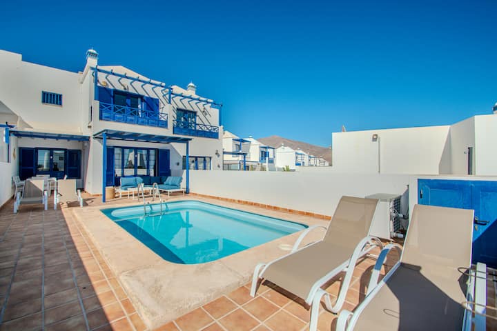 Sunny terrace, lounge and pool area at Villa Brisa del Mar