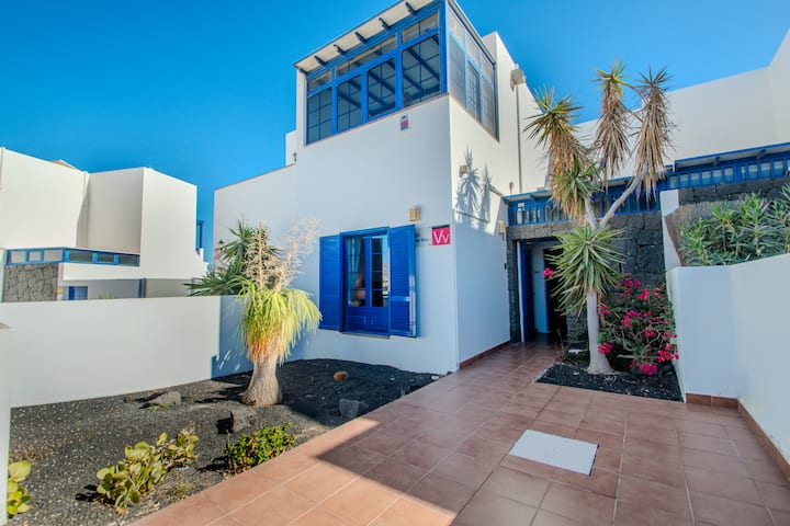 Sunny terrace, lounge and pool area at Villa Brisa del Mar
