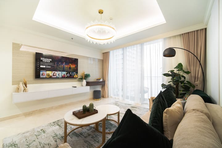 Bright living room with sea view and 65” Smart TV