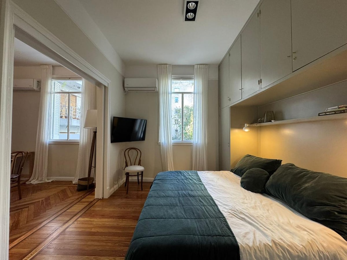 wall-mounted AC unit above the window