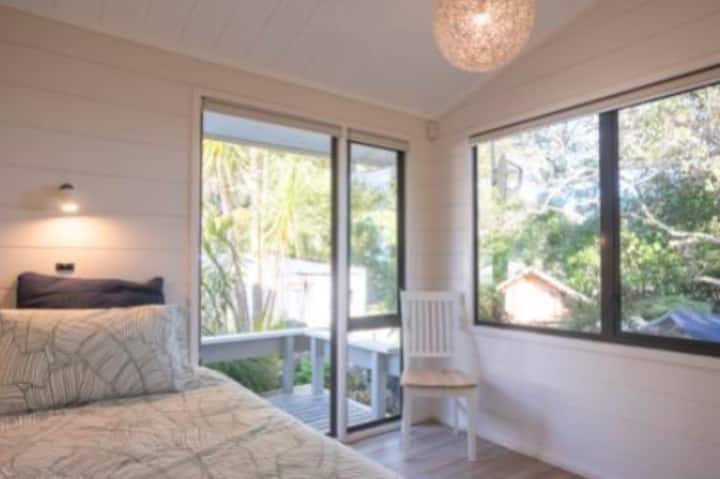 King single and trundler bedroom three with view of bush and down harbour.