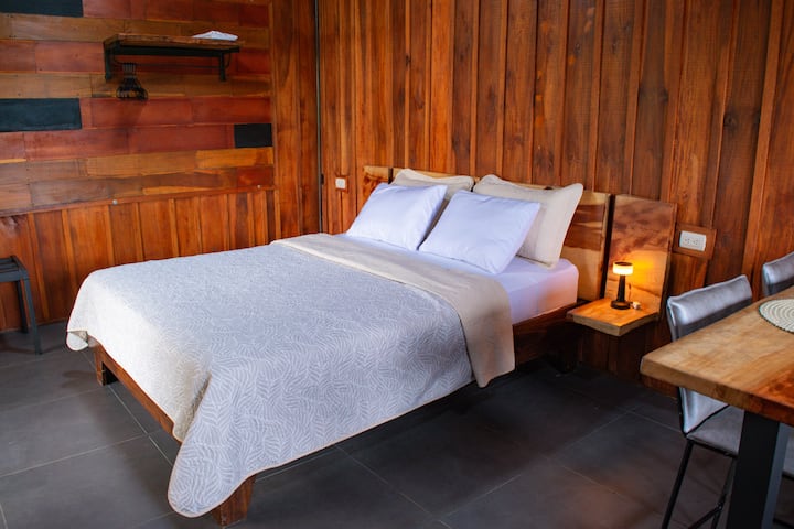 This beautiful room comes with a queen-size bed and a glass sliding door that provides direct access to your exclusive deck. stepping out onto the deck, where a bubbling hot tub awaits with an incredible view. 